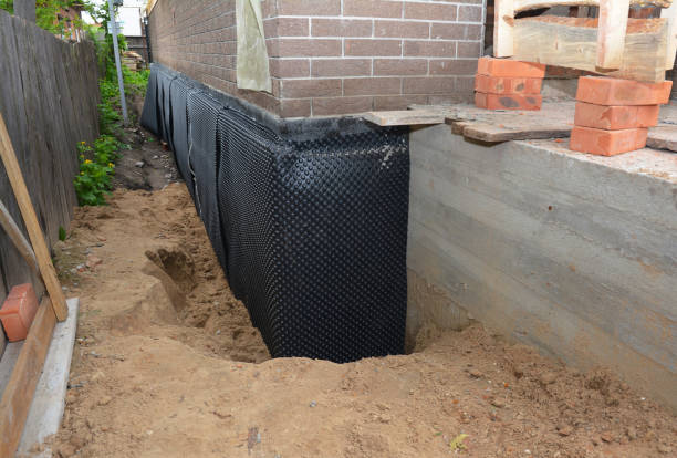 Happy homeowners after waterproofing job in Turtletown